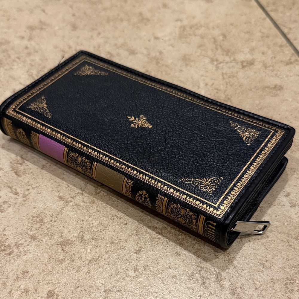 Elegant Black Book Wallet with Gold and Purple Accents